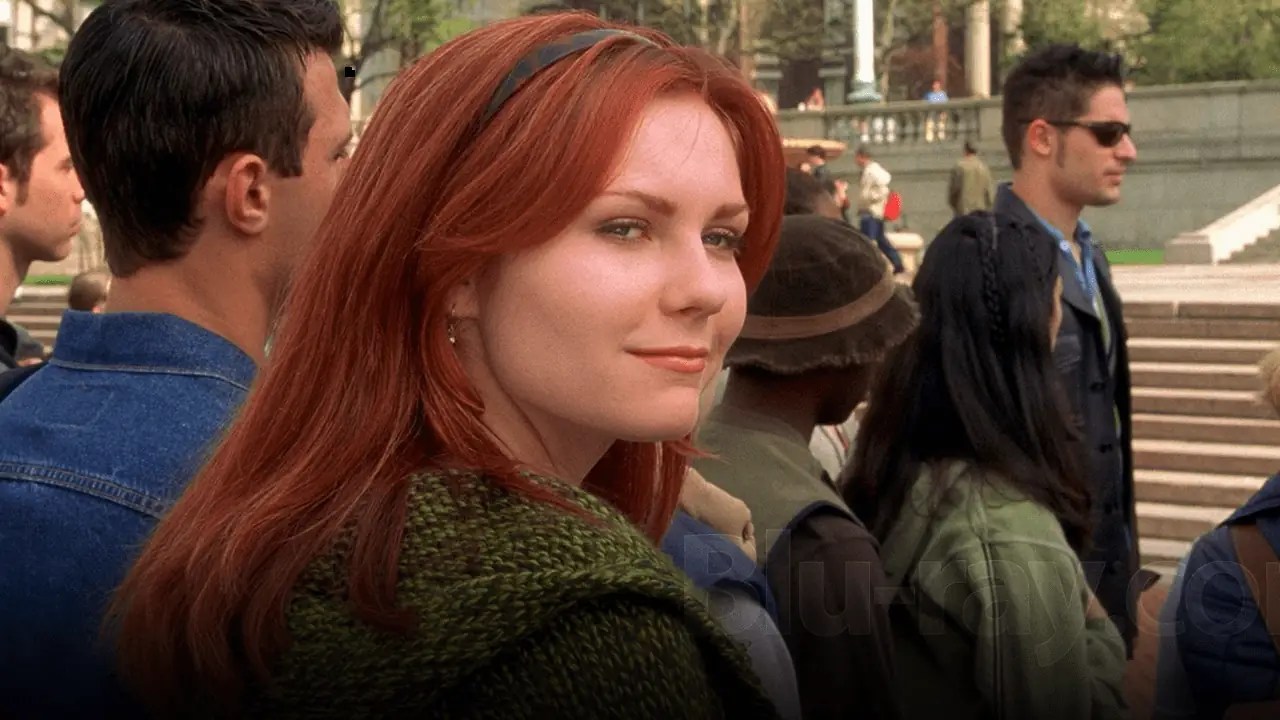 Mary Jane Watson gazes back at a crowd of people.