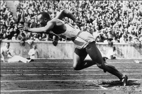 A male athlete in the 1936 Olympic Games throws a shotput in as scene taken from the 1936 film Olympia.