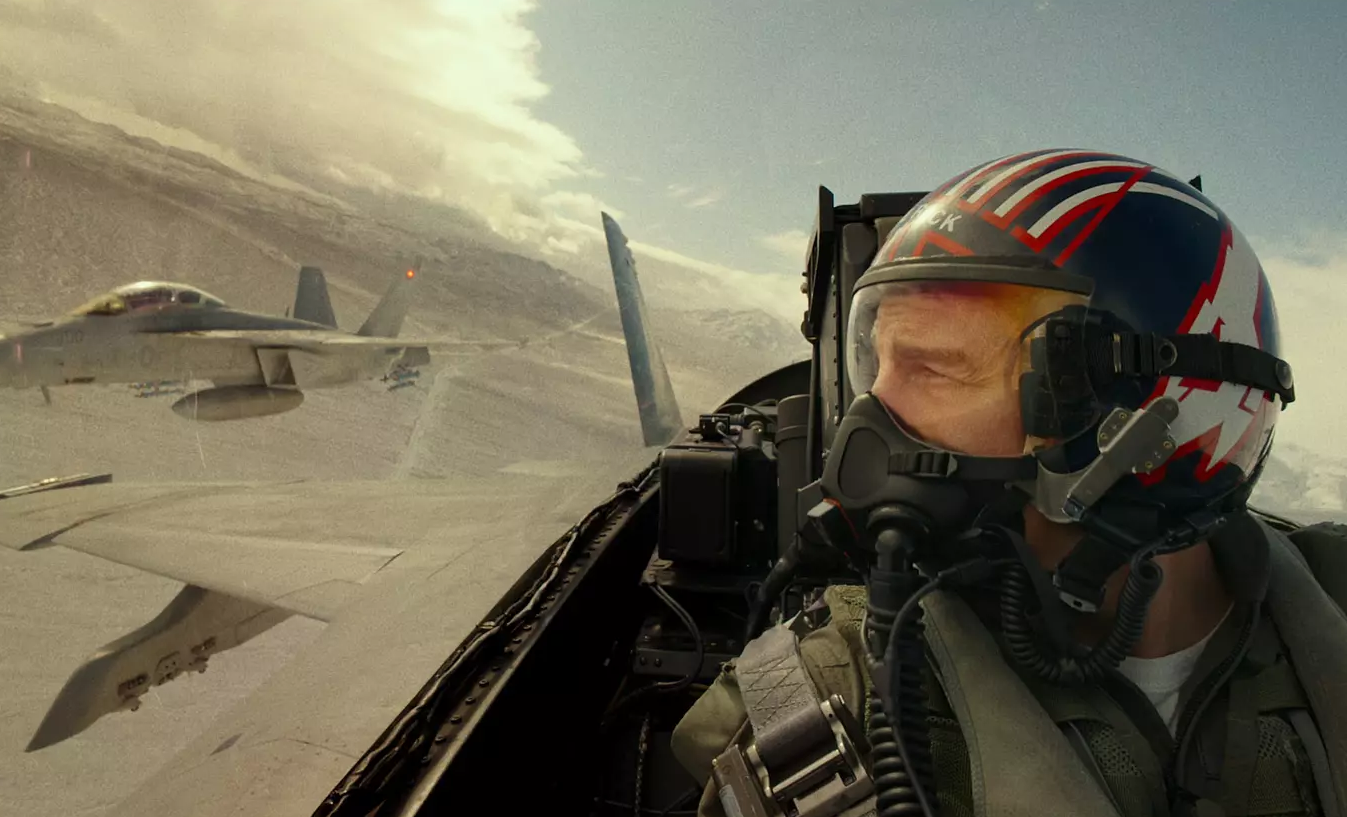 Tom Cruise in the cockpit of an airplane in Top Gun: Maverick.